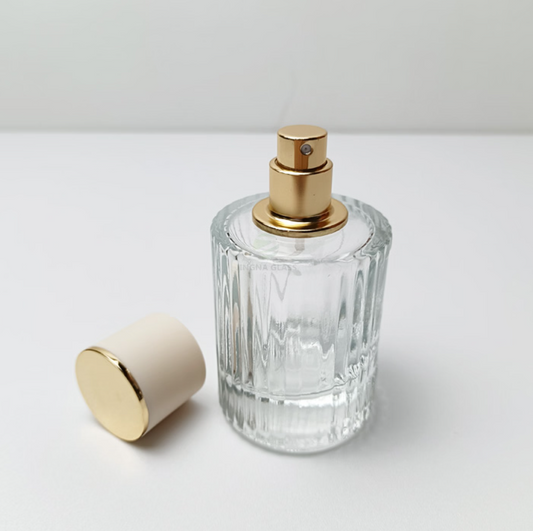 Botella de perfume vacía de 30 ml hecha de vidrio transparente.